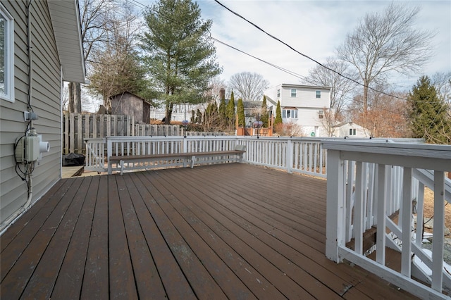 deck with a residential view and fence