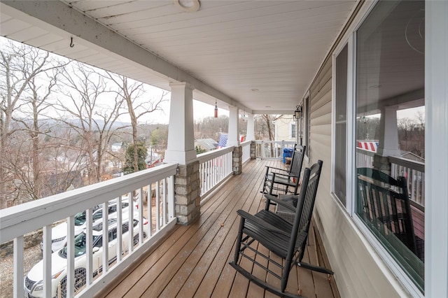 wooden terrace with a porch