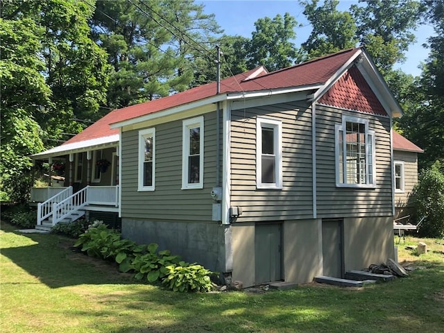 65 Boris Rd, Bloomingburg, NY 12721 - view of side of home with a yard and covered porch