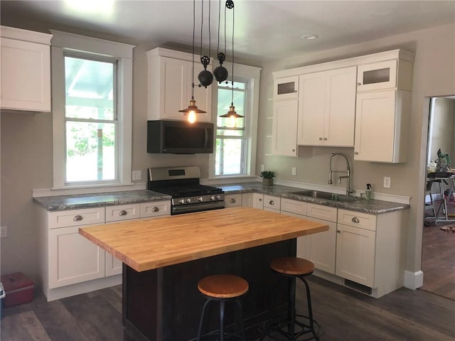65 Boris Rd, Bloomingburg, NY 12721 - kitchen with a sink, white cabinets, stainless steel gas range, and butcher block counters