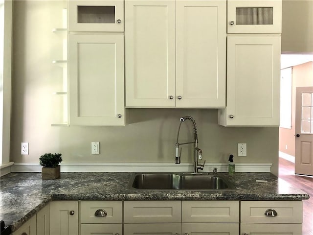 65 Boris Rd, Bloomingburg, NY 12721 - kitchen featuring visible vents, a sink, dark stone counters, white cabinets, and glass insert cabinets