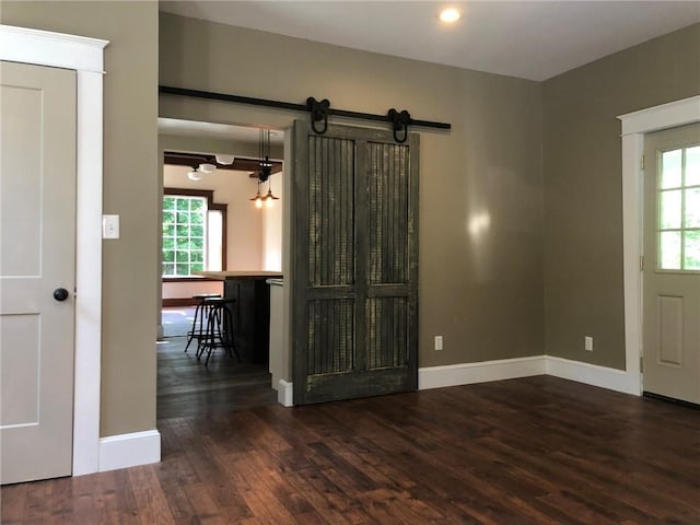 65 Boris Rd, Bloomingburg, NY 12721 - interior space featuring a wealth of natural light, a barn door, baseboards, and wood finished floors