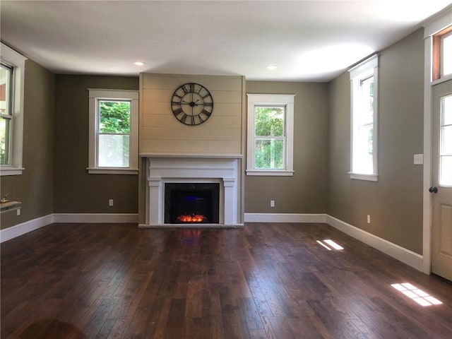 65 Boris Rd, Bloomingburg, NY 12721 - unfurnished living room with hardwood / wood-style floors, baseboards, and a lit fireplace