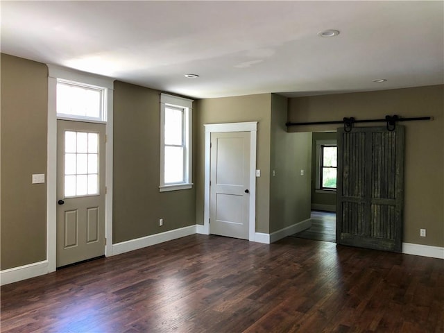 65 Boris Rd, Bloomingburg, NY 12721 - entryway featuring baseboards, a barn door, and wood finished floors