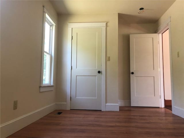 65 Boris Rd, Bloomingburg, NY 12721 - unfurnished bedroom featuring visible vents, baseboards, and wood finished floors