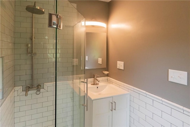 65 Boris Rd, Bloomingburg, NY 12721 - bathroom with wainscoting, a shower stall, vanity, and tile walls