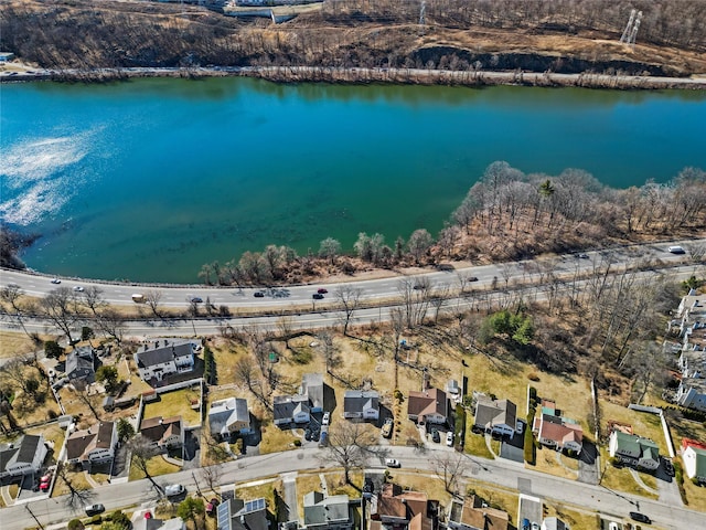 drone / aerial view with a residential view and a water view