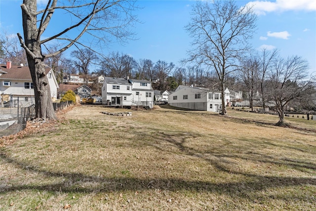 view of yard featuring a residential view and fence