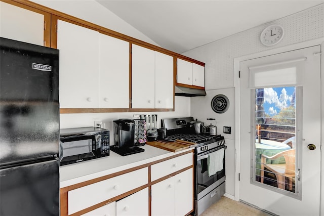 kitchen with visible vents, black appliances, white cabinets, light countertops, and lofted ceiling