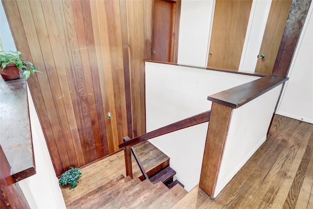 stairway with wood finished floors