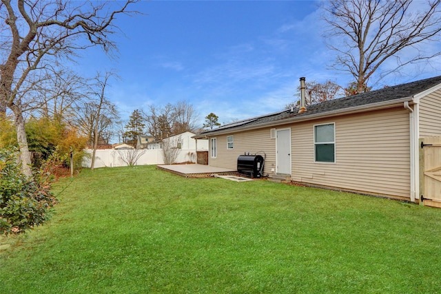 view of yard featuring a patio and fence