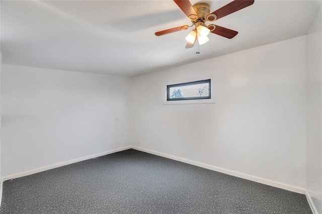 unfurnished room featuring baseboards and ceiling fan