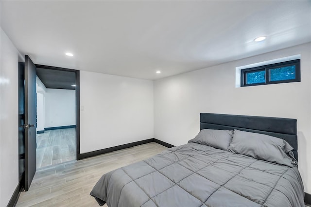 bedroom featuring recessed lighting, baseboards, and wood finished floors