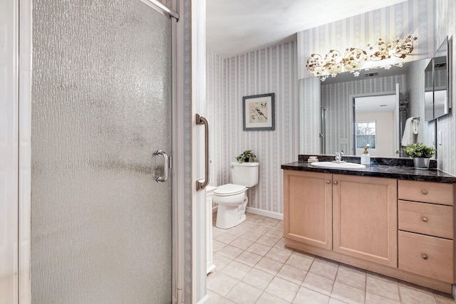 full bath with tile patterned floors, toilet, a shower stall, wallpapered walls, and vanity