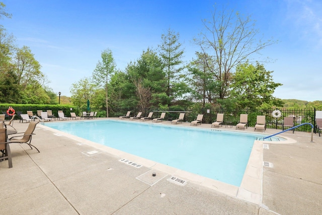 pool featuring a patio and fence