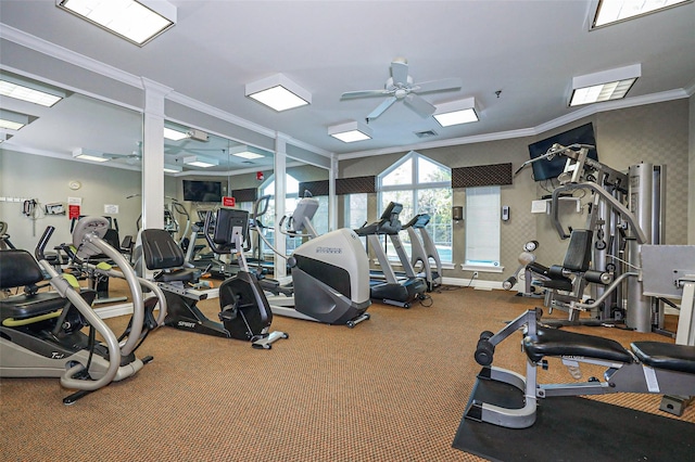 gym with ceiling fan, baseboards, carpet floors, and ornamental molding