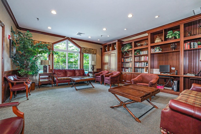 living room with visible vents, built in study area, crown molding, and carpet floors