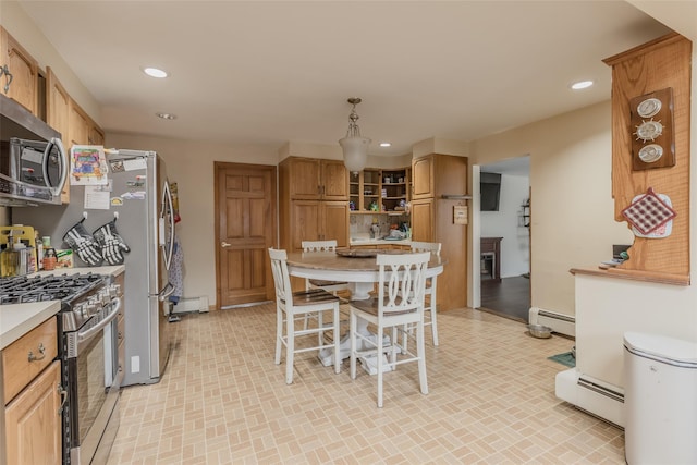 kitchen with recessed lighting, a baseboard radiator, baseboard heating, and stainless steel appliances