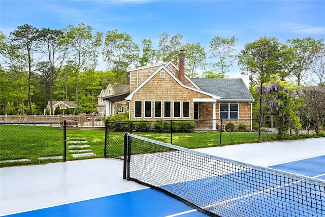 3 Arbutus Rd, Quogue, NY 11959 - view of front of house with a gate and a chimney