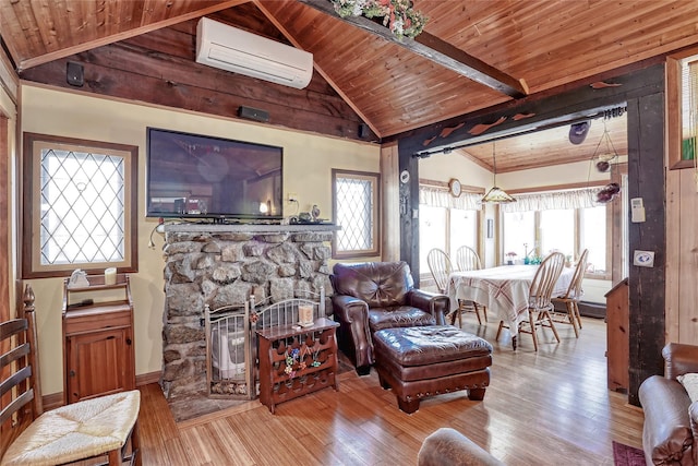 living area with vaulted ceiling with beams, wooden ceiling, a fireplace, hardwood / wood-style flooring, and a wall mounted AC