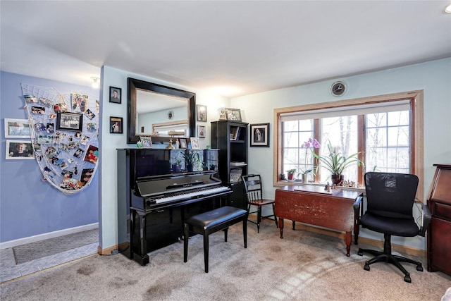 sitting room featuring baseboards and light colored carpet