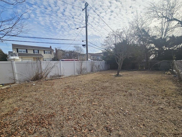 view of yard featuring a fenced backyard