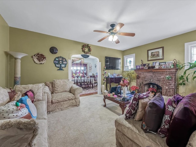 142-02 185th St, Springfield Gardens, NY 11413 - carpeted living room with a fireplace and ceiling fan with notable chandelier