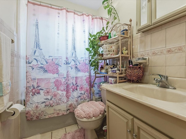 142-02 185th St, Springfield Gardens, NY 11413 - full bathroom featuring tile patterned floors, shower / bathtub combination with curtain, toilet, tile walls, and vanity