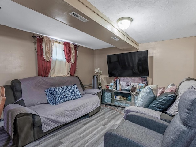 142-02 185th St, Springfield Gardens, NY 11413 - living room featuring wood finished floors and visible vents