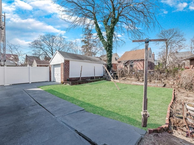 142-02 185th St, Springfield Gardens, NY 11413 - view of yard with an outbuilding, fence, a residential view, and driveway