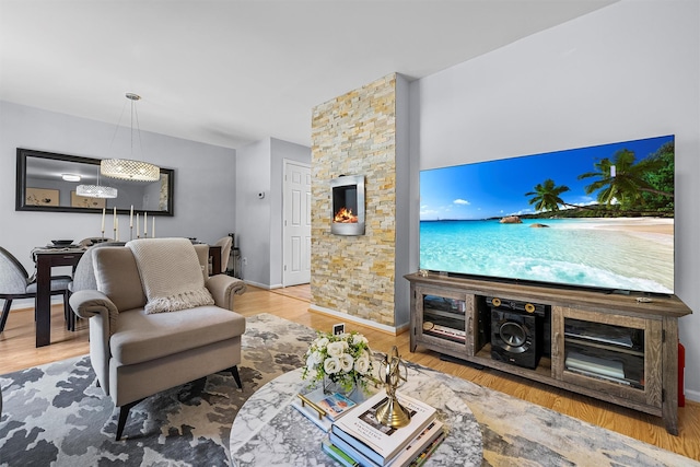 living area with wood finished floors and baseboards