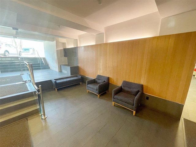 bedroom featuring wood walls and wood finished floors