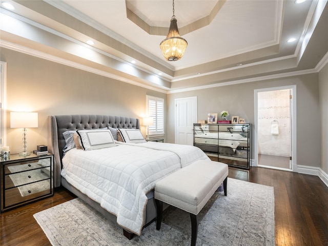 bedroom with baseboards, a tray ceiling, dark wood-style flooring, crown molding, and a notable chandelier