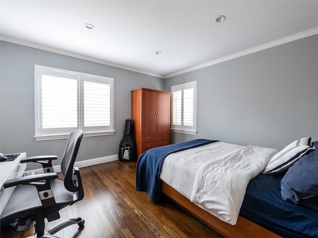 bedroom with baseboards, crown molding, and hardwood / wood-style flooring