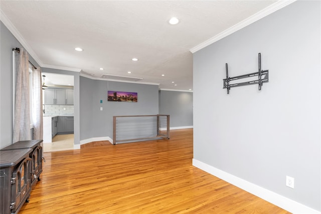 living area with crown molding, recessed lighting, baseboards, and light wood finished floors