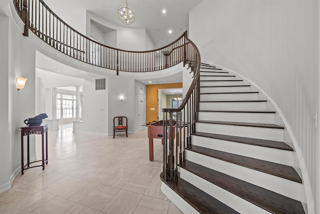 2 Camden Ct, Irvington, NY 10533 - stairs featuring a chandelier and a high ceiling