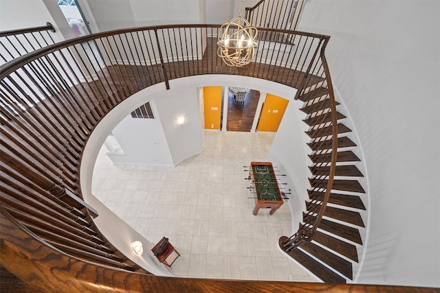 2 Camden Ct, Irvington, NY 10533 - staircase with arched walkways and a chandelier