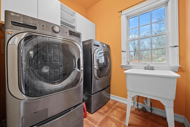 2 Camden Ct, Irvington, NY 10533 - washroom with washing machine and dryer and light tile patterned floors