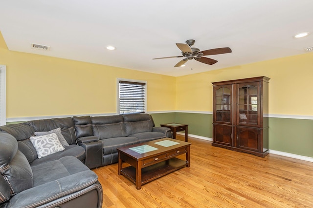 living room with recessed lighting, visible vents, light wood-style floors, and a ceiling fan