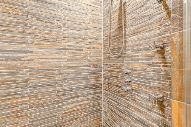 details with a tile shower