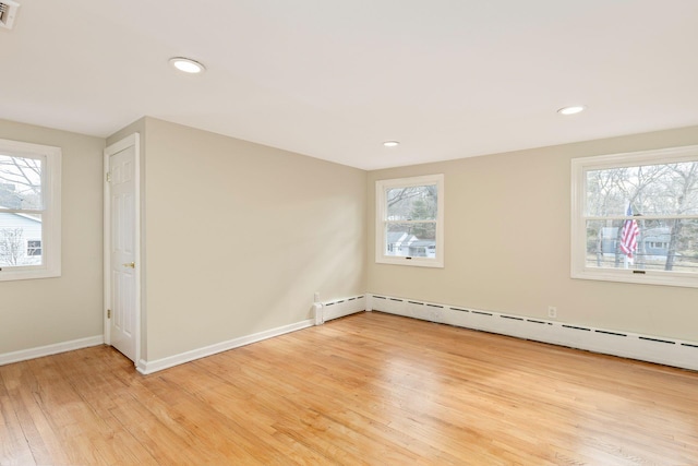 spare room with recessed lighting, visible vents, baseboards, and light wood-style flooring