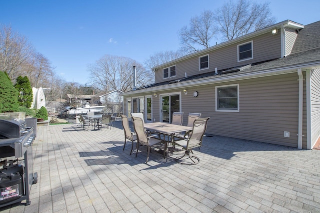 wooden deck with outdoor dining space and fence