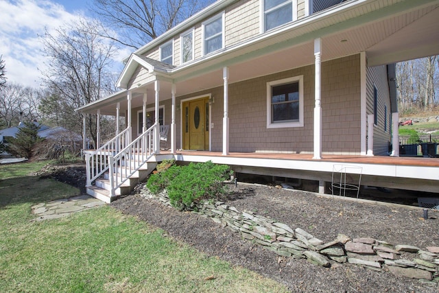 view of exterior entry featuring a porch