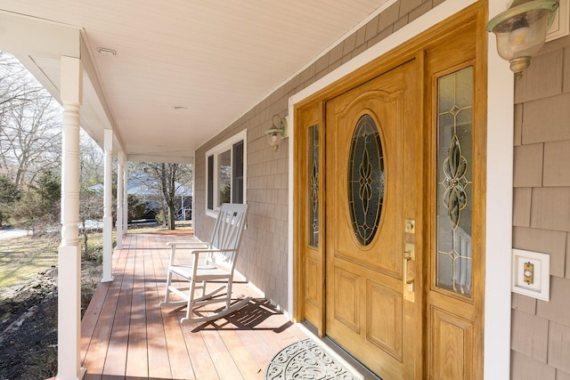 property entrance featuring covered porch