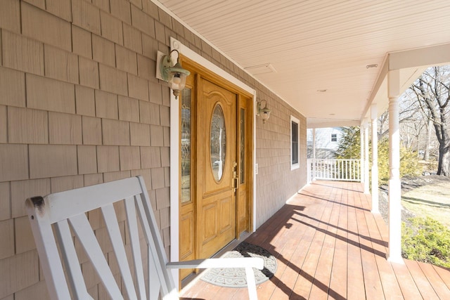 entrance to property featuring a porch