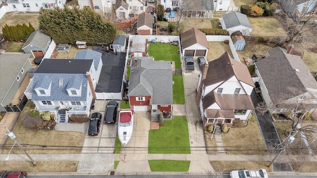 birds eye view of property with a residential view