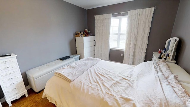 bedroom with wood finished floors