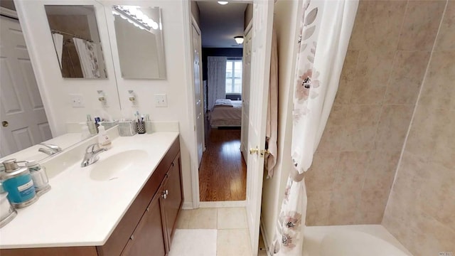 full bath with vanity and tile patterned floors