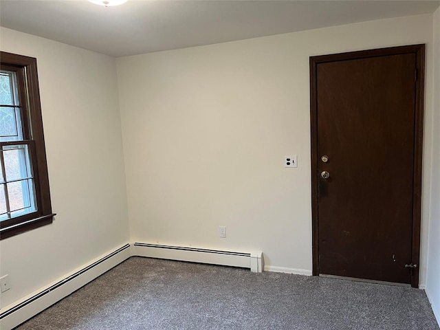 unfurnished room with a baseboard radiator, baseboards, and carpet flooring