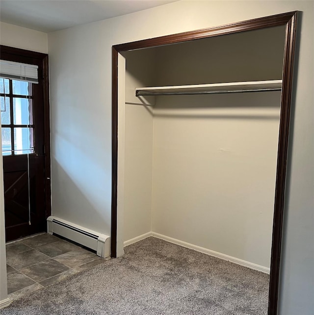 closet featuring a baseboard radiator